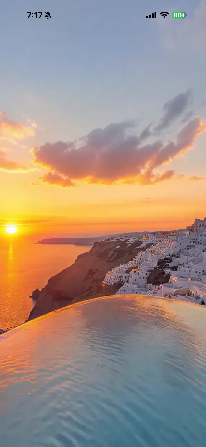 Santorini sunset over an infinity pool