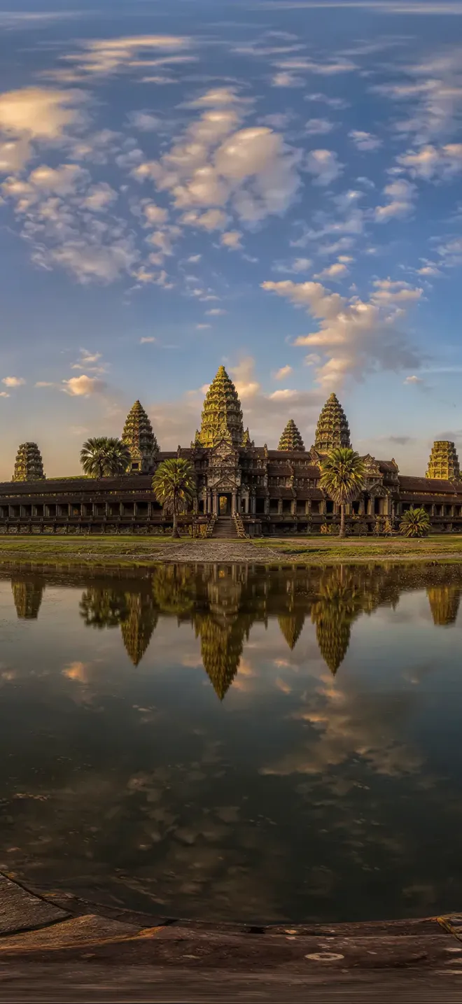 Angkor Wat temple at sunrise reflected in water